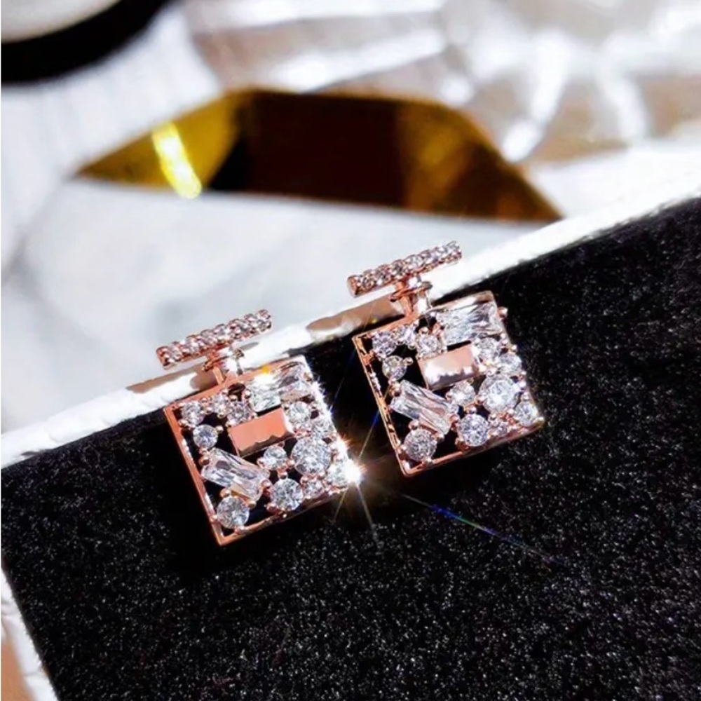 Bottle shaped stud earrings (rose gold tone)